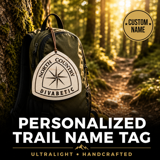 Backpack with a personalized trail name tag in a forest setting