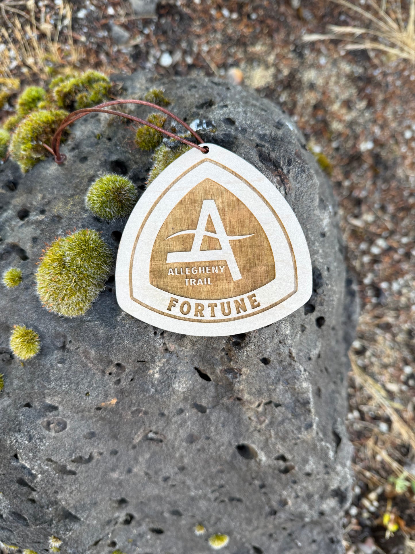 Handcrafted wooden hiking backpack tag with leather cord. Lightweight personalized hiking accessory made for Allegheny Trail adventures, backpacking trips, and trail memories.