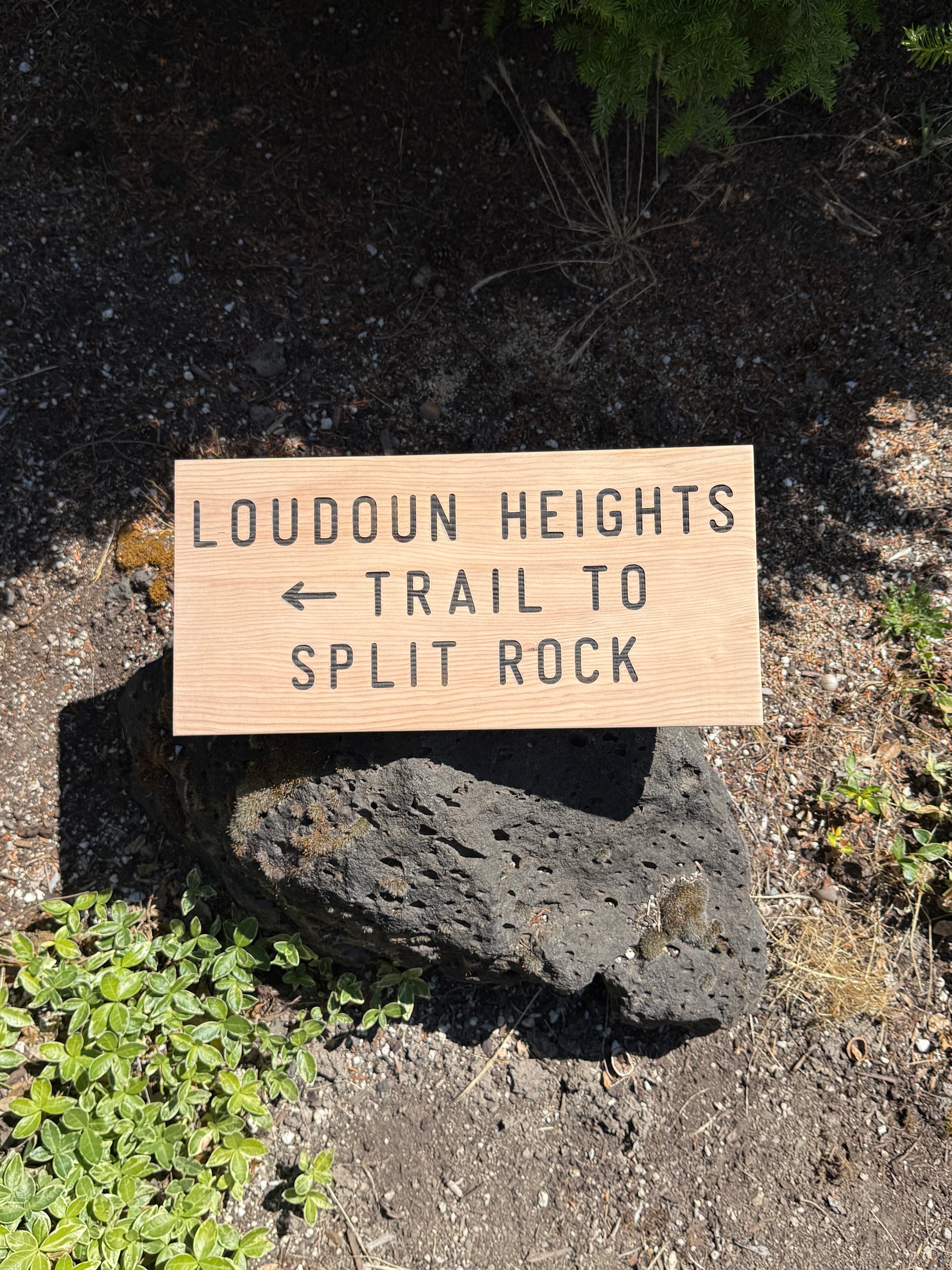 Rustic wooden trail sign showing Loudoun Heights Trail to Split Rock on the Appalachian Trail