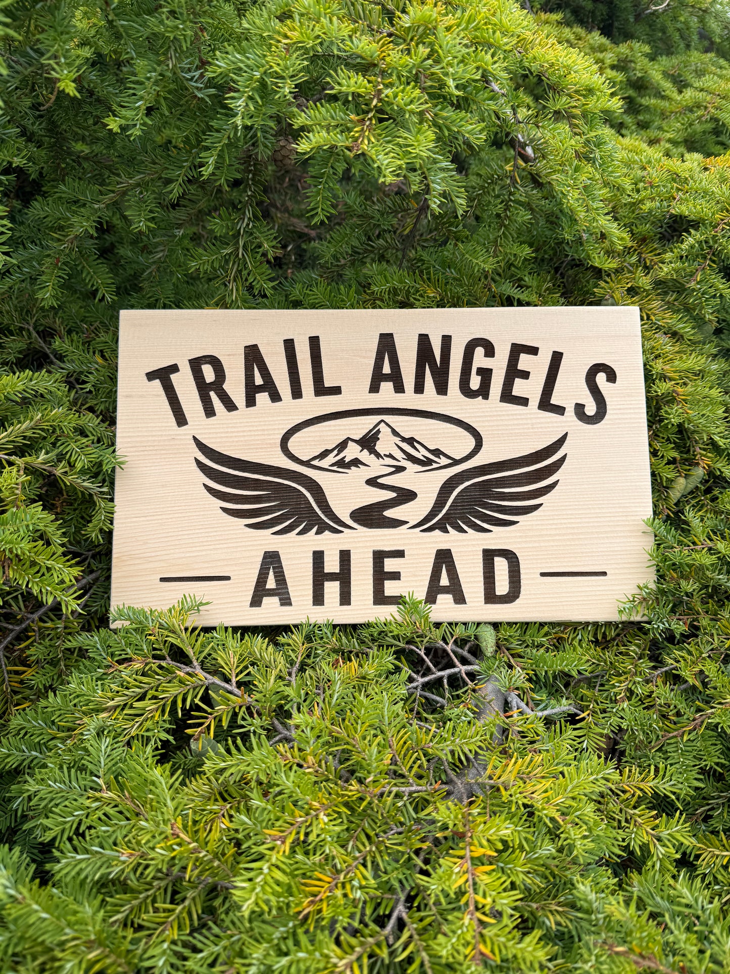 Trail Angels Ahead sign marking a trail magic stop where hikers can rest, eat, and enjoy trail hospitality.